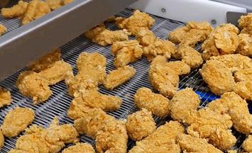 Freezing chicken nuggets in spiral freezer